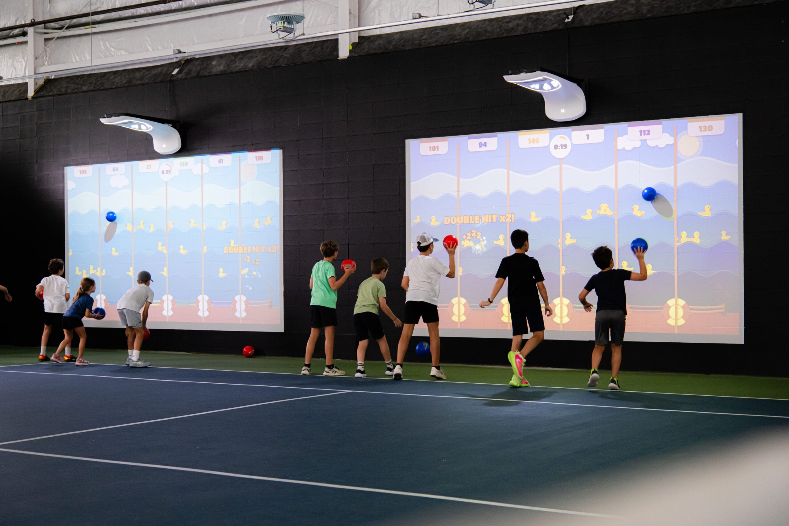 Participants playing with a Lü interactive projection