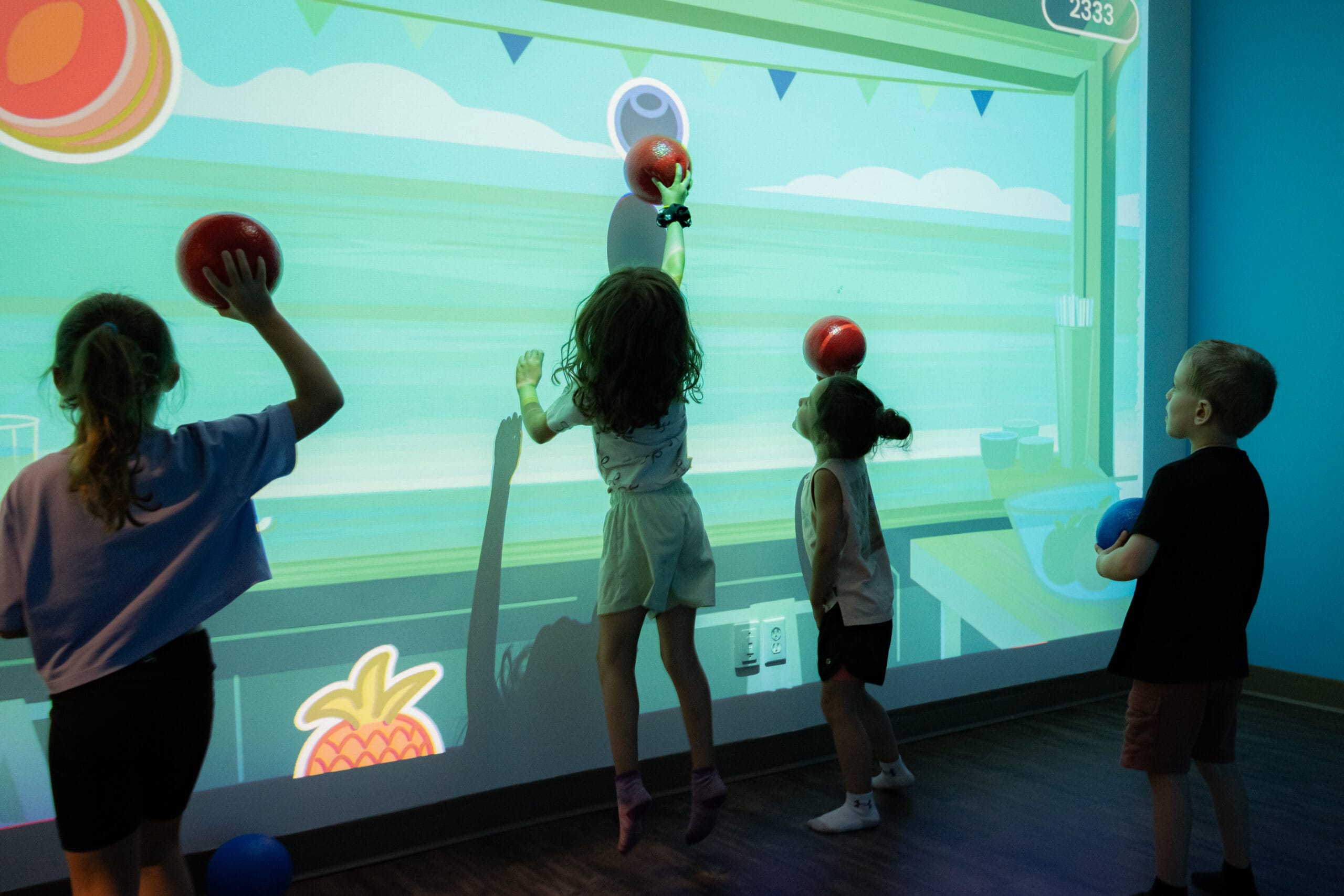 Guests playing with a Lü interactive projection